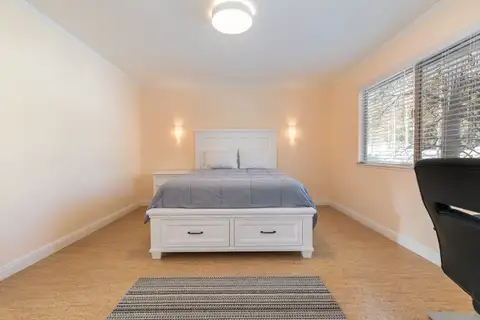 Bedroom with a white bed frame and window, Trailside Tahoe Townhouse