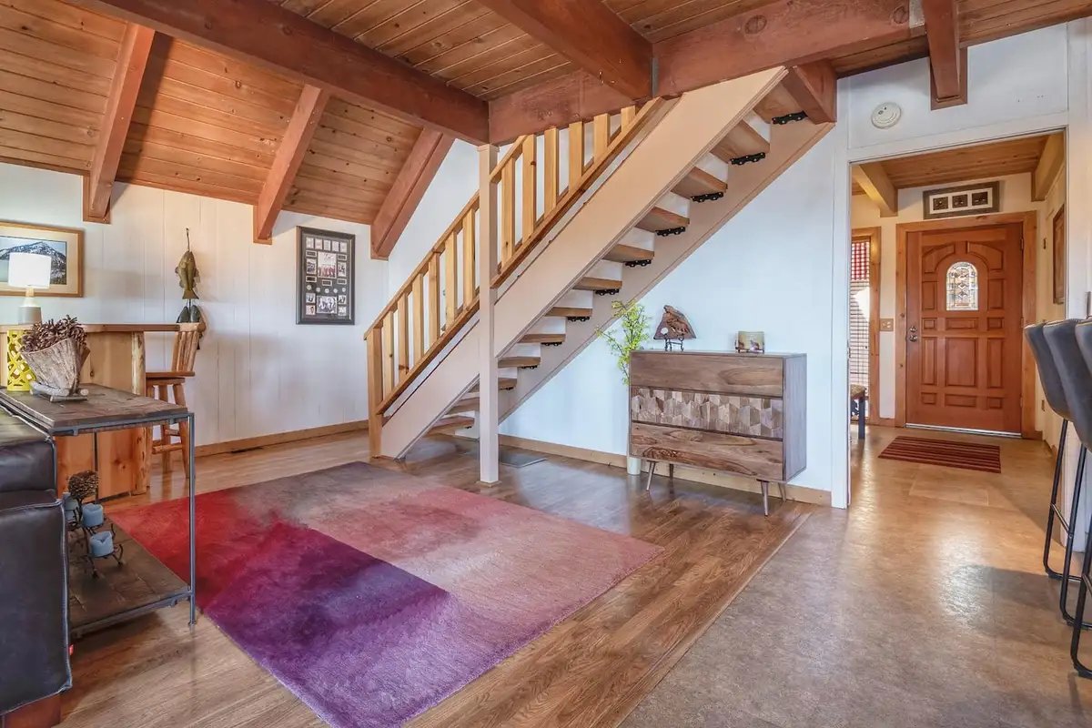 Open staircase near the front door and living area, Lakeview Serenity Cottage