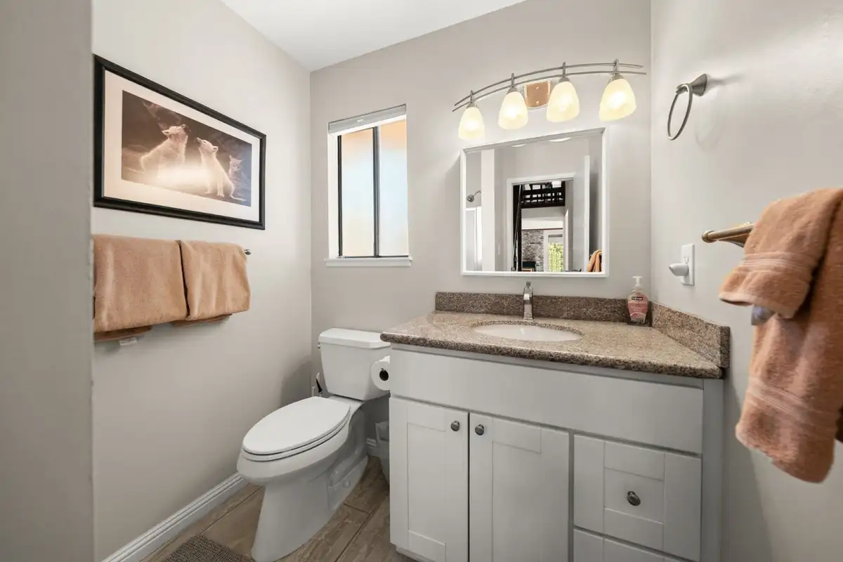 Bathroom with a vanity and framed art, Skiway Suite