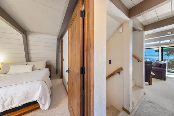 A-frame bedroom with a bed and sliding barn door, Livin' on the Edge