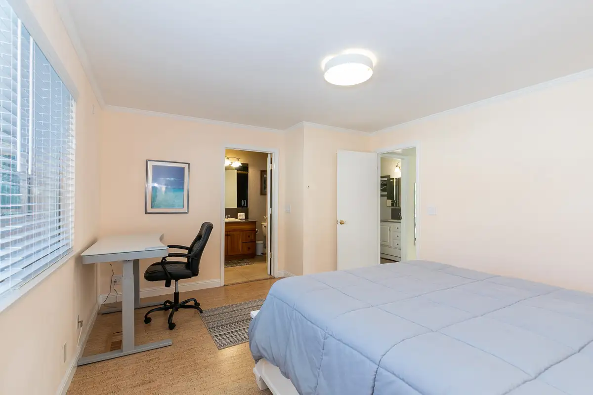 Bedroom with a bed and a desk, Trailside Tahoe Townhouse