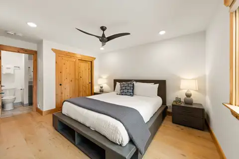 Bedroom with a bed and doorway to a bathroom, Sugar Pine Tahoe Lodge