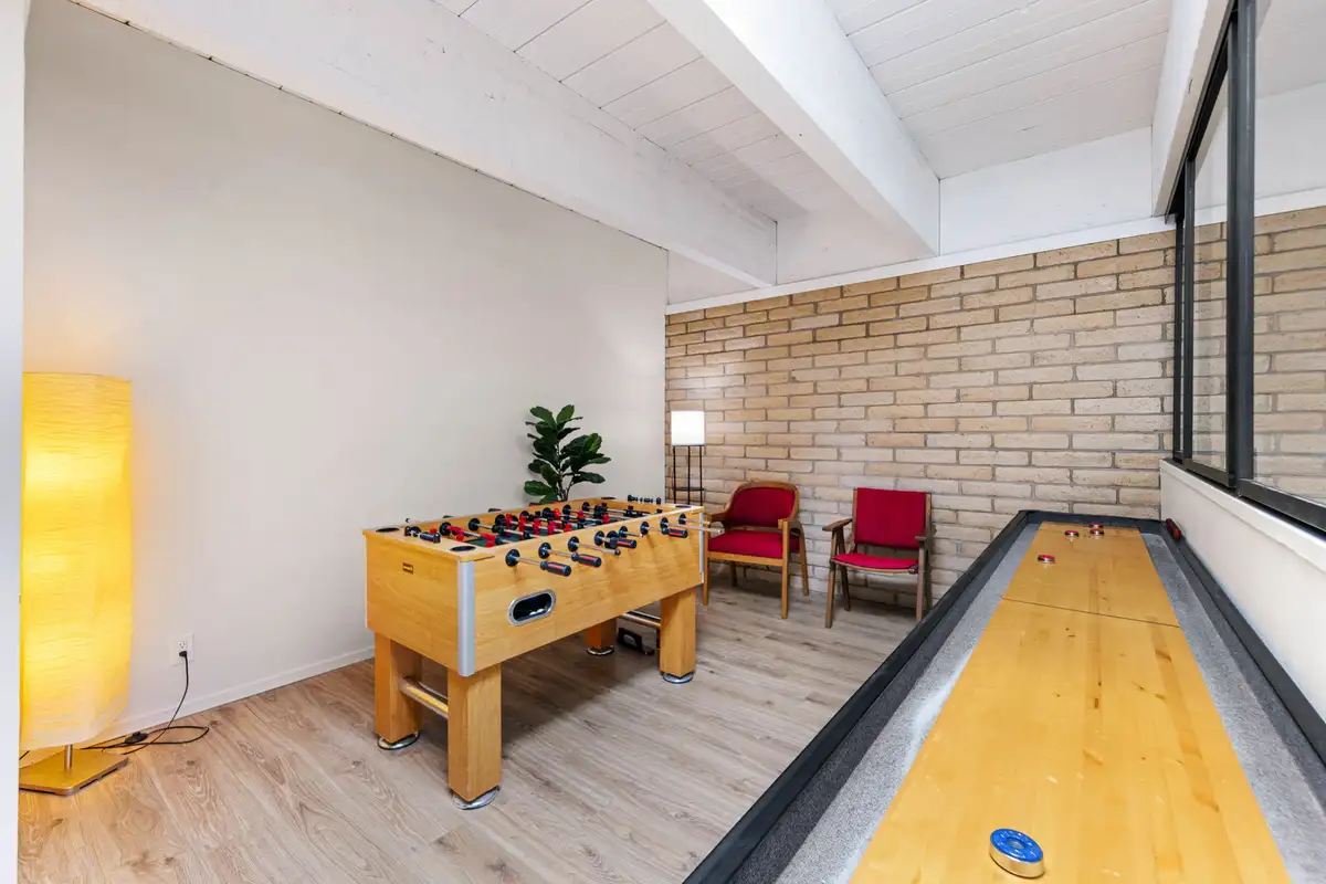 Game room with foosball table and shuffleboard, Treetop on Country Club