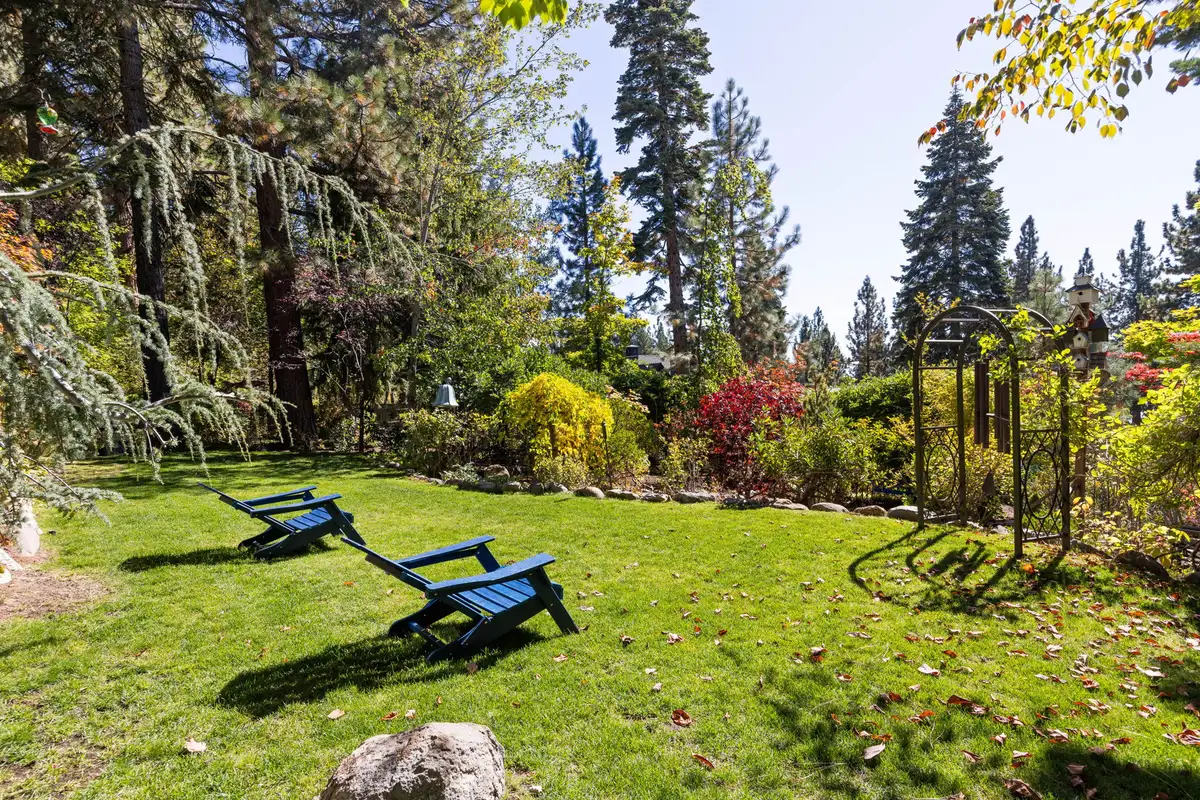Lawn with two Adirondack chairs and garden beds, Incline Lakeside Haven