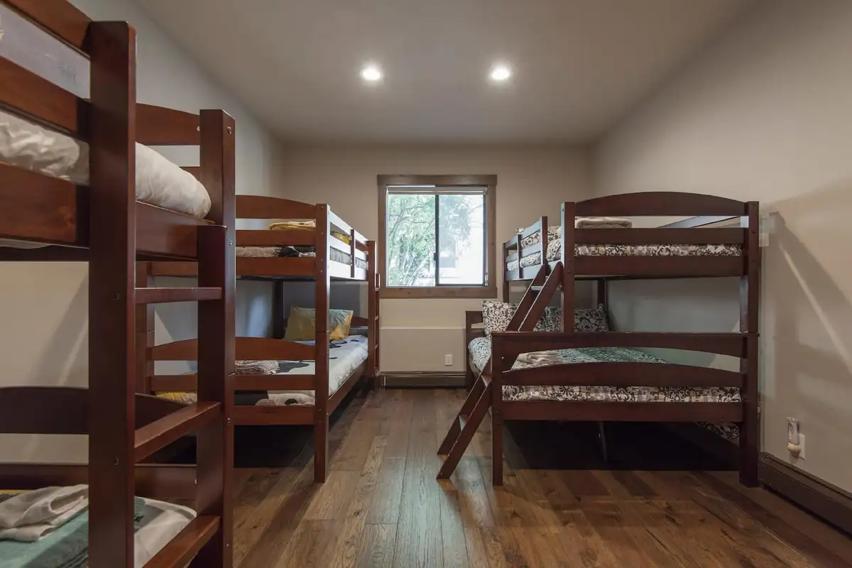 Bunk room with several wooden bunk beds, Tranquil Tahoe Haven