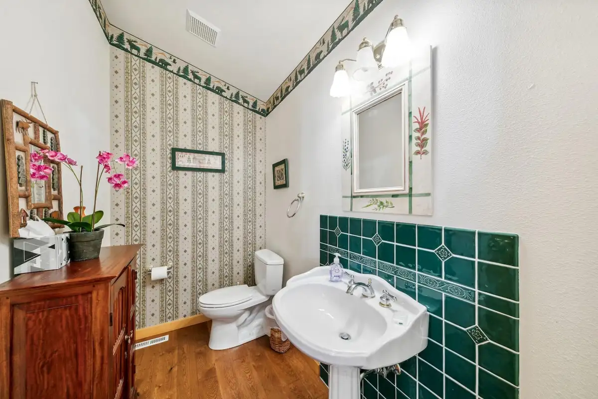 Half bath with pedestal sink and green tile, Hastings Hideaway Cabin