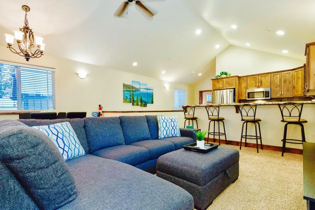 Sectional sofa with the breakfast bar and kitchen behind, Trout and About