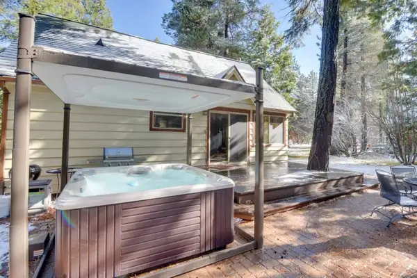 Chilling in the posh 6 person hot tub with a waterfall and disco lights, Tranquil Trails Cabin