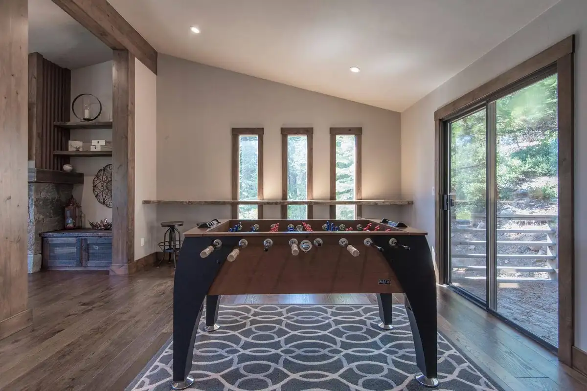 Game area with a foosball table by sliding doors, Tranquil Tahoe Haven