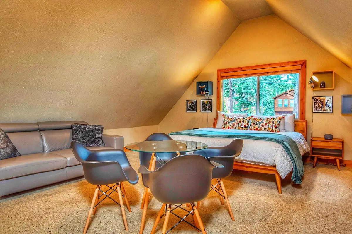 Loft bedroom with a bed, sofa and small round table, Restful North Ridge