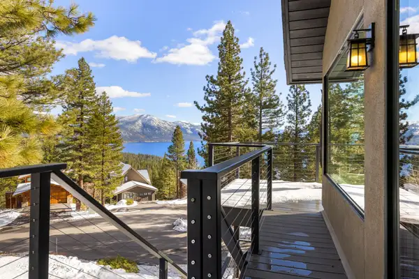 Deck with Lake Tahoe and mountains visible beyond the pines, Incline Lakehouse Lookout