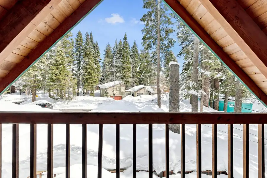 Snowy neighborhood seen through an A-frame balcony, Patton's Pfeiffer Cabin