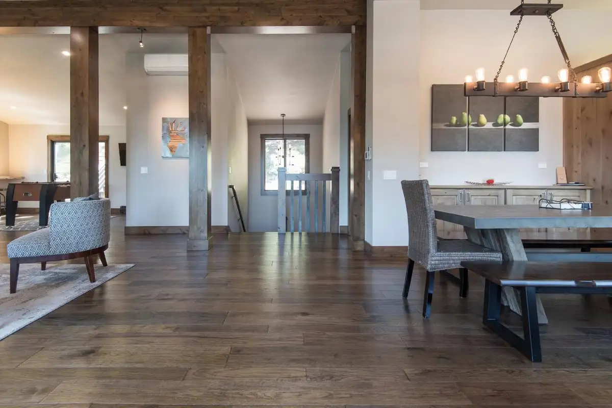 Dining area with long table and wood posts, Tranquil Tahoe Haven