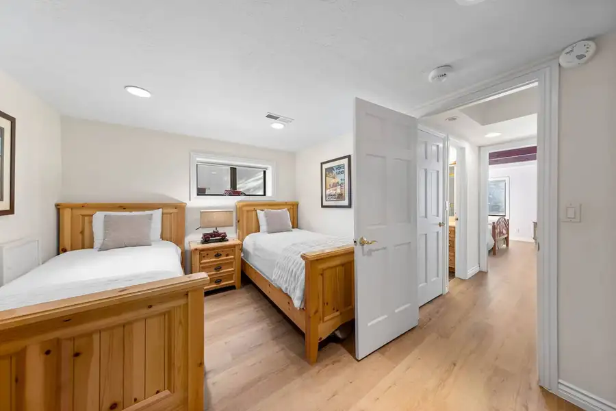 Bedroom with two twin beds in wood frames, Tranquil Alpine Bliss