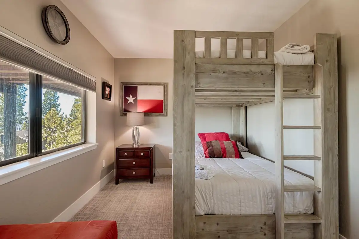 Bunk room with a wood bunk bed and window, Skylake Serenity Retreat