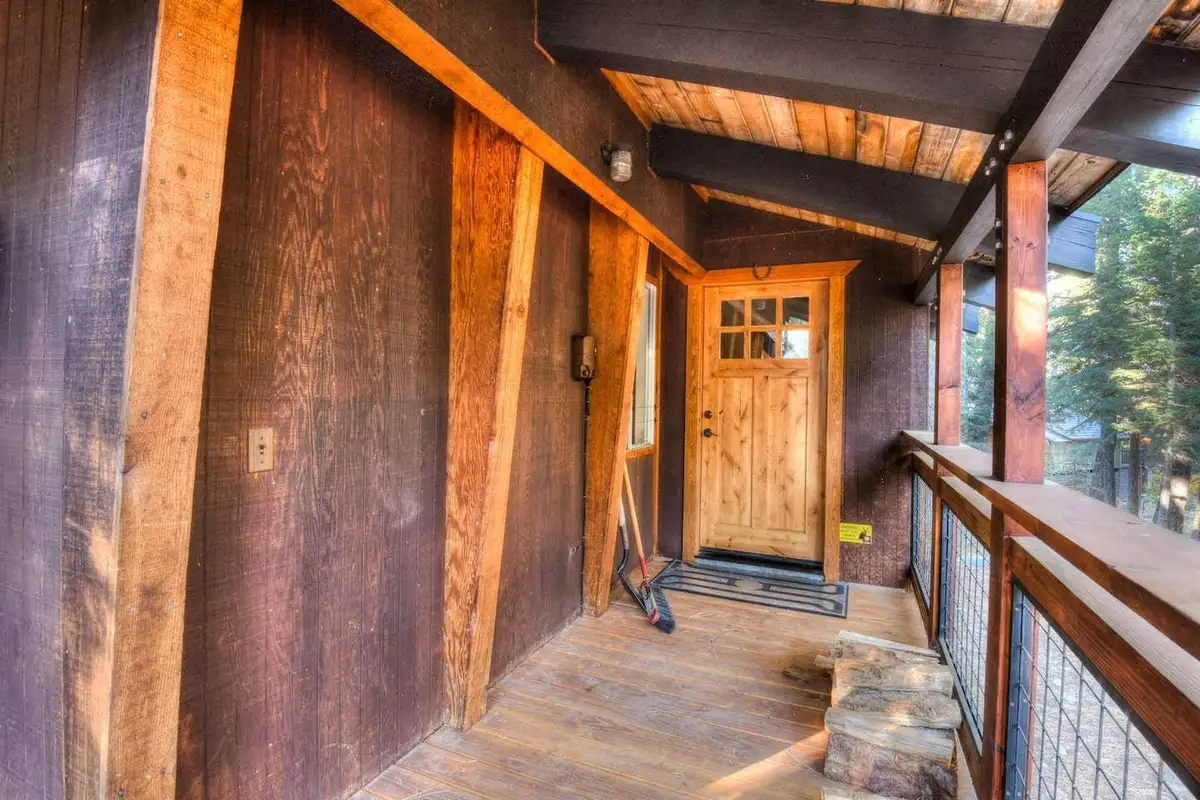 Covered wooden walkway leading to the front door, Enchanting Chamberlands Cabin
