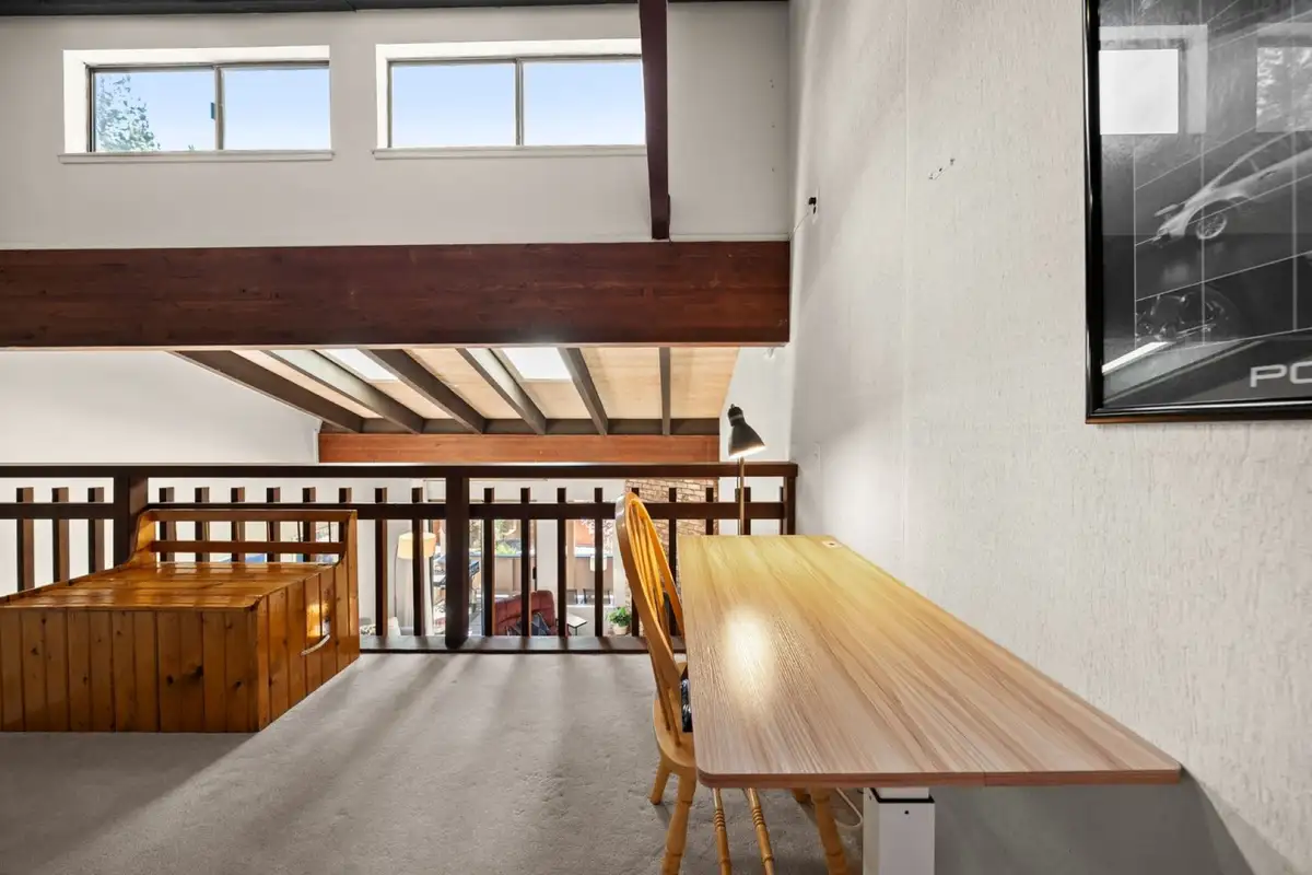 Loft with a desk overlooking the room below, Skiway Suite