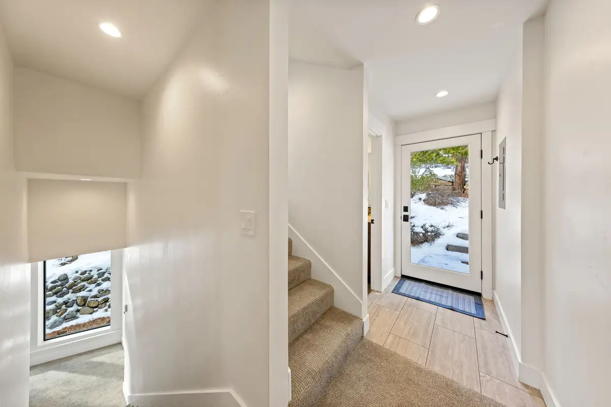 Entry hallway with stairs and a glass back door, Incline Lakehouse Lookout