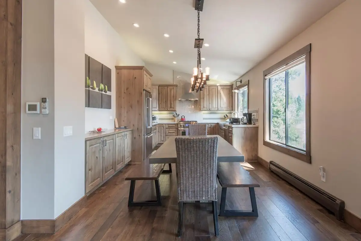 Long dining table with kitchen beyond, Tranquil Tahoe Haven