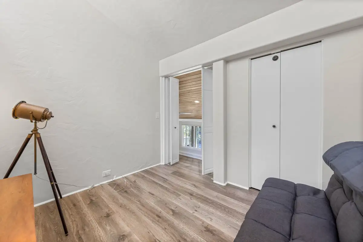 Room with a tripod lamp and closet doors, Lakeview Haven in Incline Village