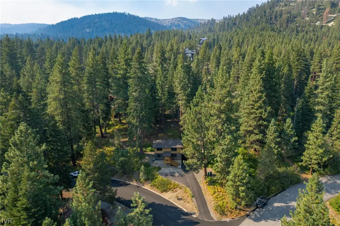 Aerial view of a home surrounded by pine forest, Sugar Pine Tahoe Lodge
