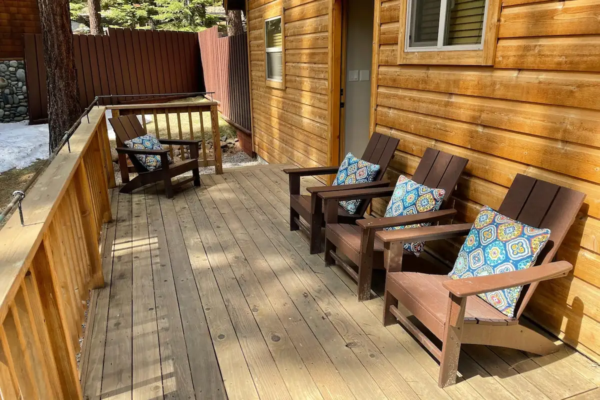 Covered porch with wooden Adirondack chairs, Restful North Ridge