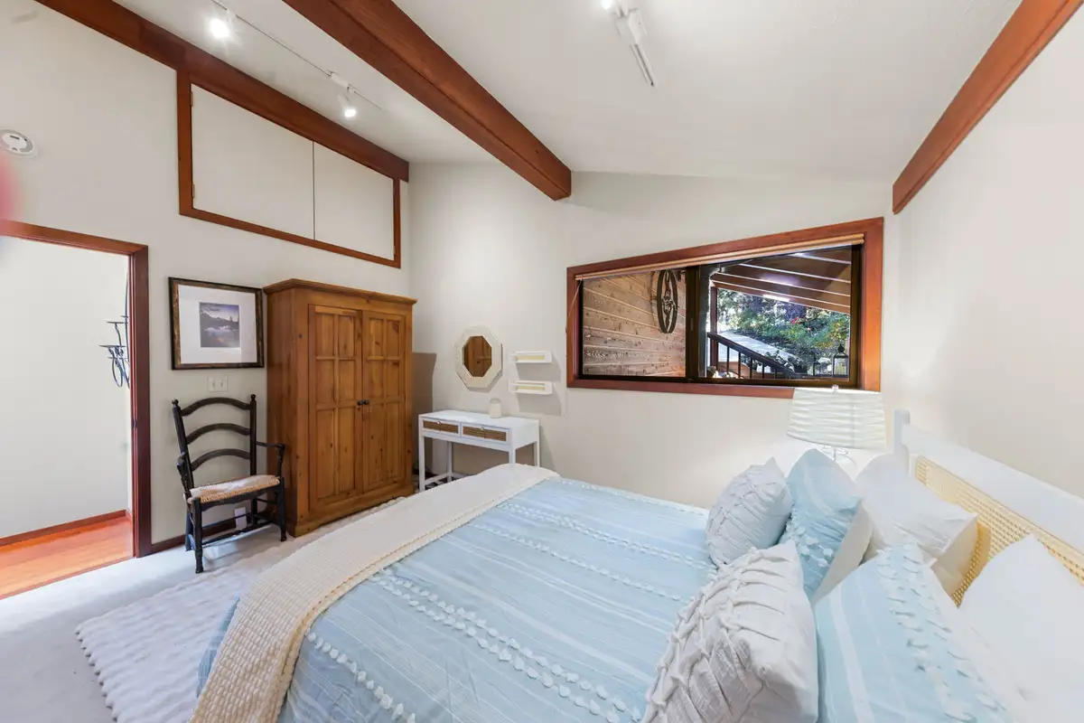 Bedroom with a bed and wood armoire, Incline Lakeside Haven