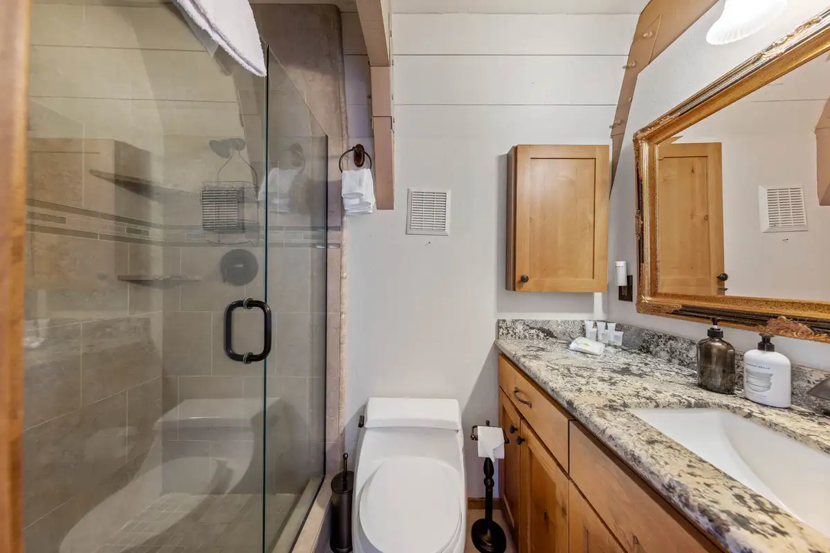 Bathroom with glass shower and granite vanity, Livin' on the Edge