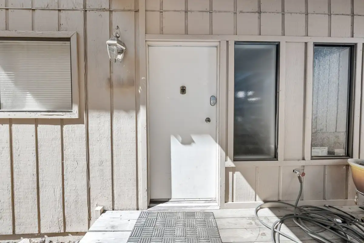 Front door with a doormat, Skiway Suite