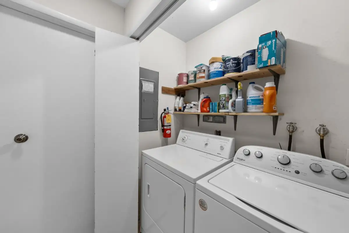 Laundry room with top-load washer and dryer, Skiway Suite