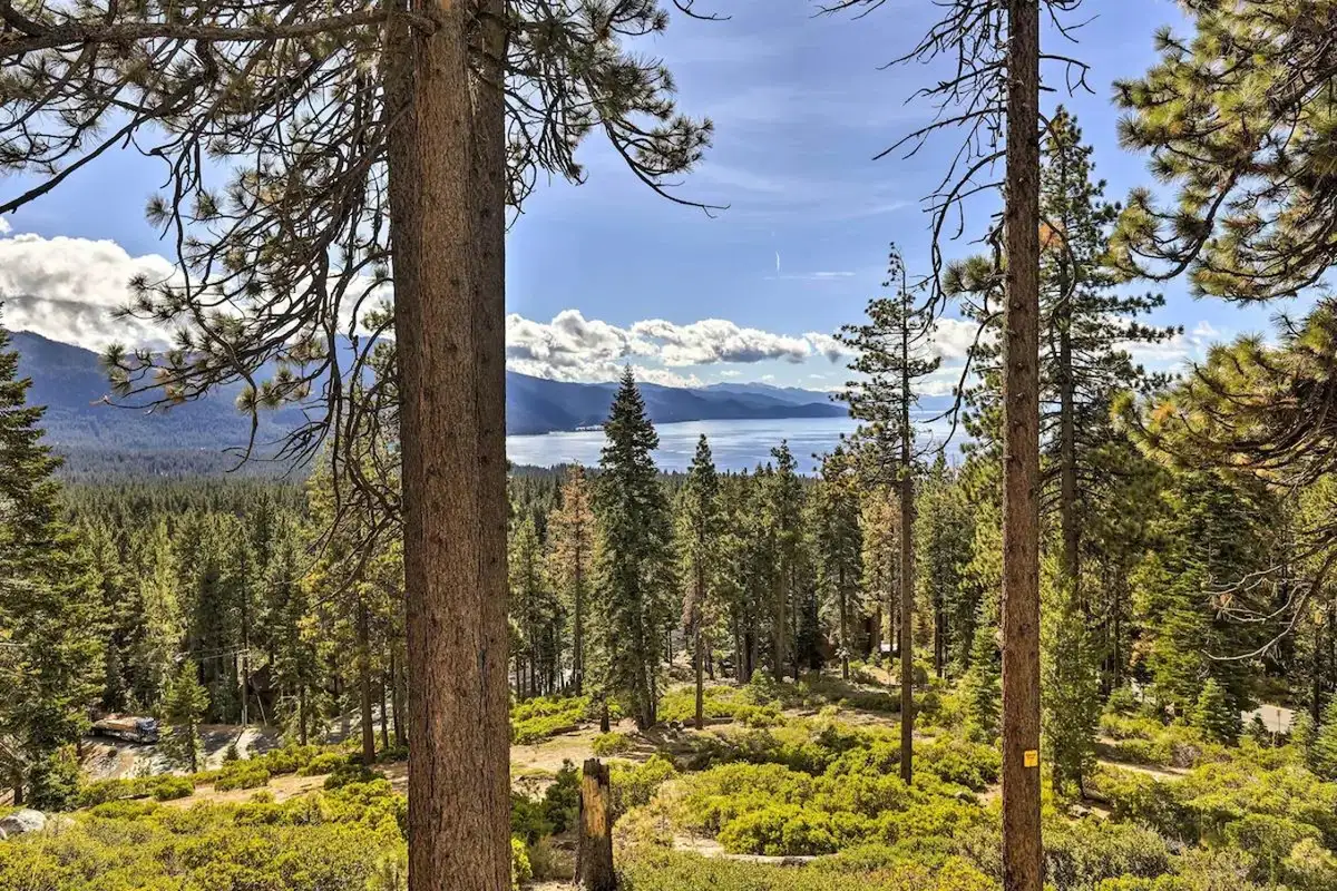 Forest view with Lake Tahoe and mountains in the distance, Lakeview Oasis