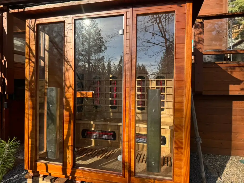 Outdoor sauna with glass front and wood frame, Incline Lakeside Haven