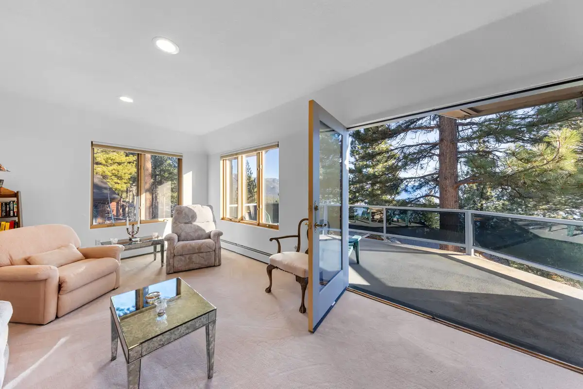 Sitting room with open door to a balcony, 90s Tahoe Time Capsule