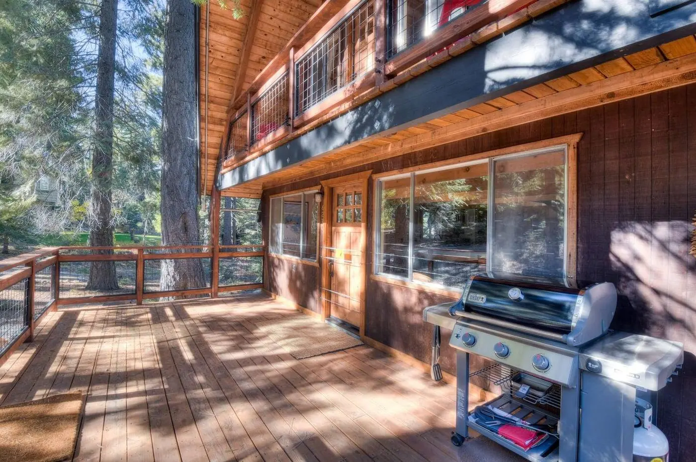 The deck at Enchanting Chamberlands Cabin, an MG home in Tahoma