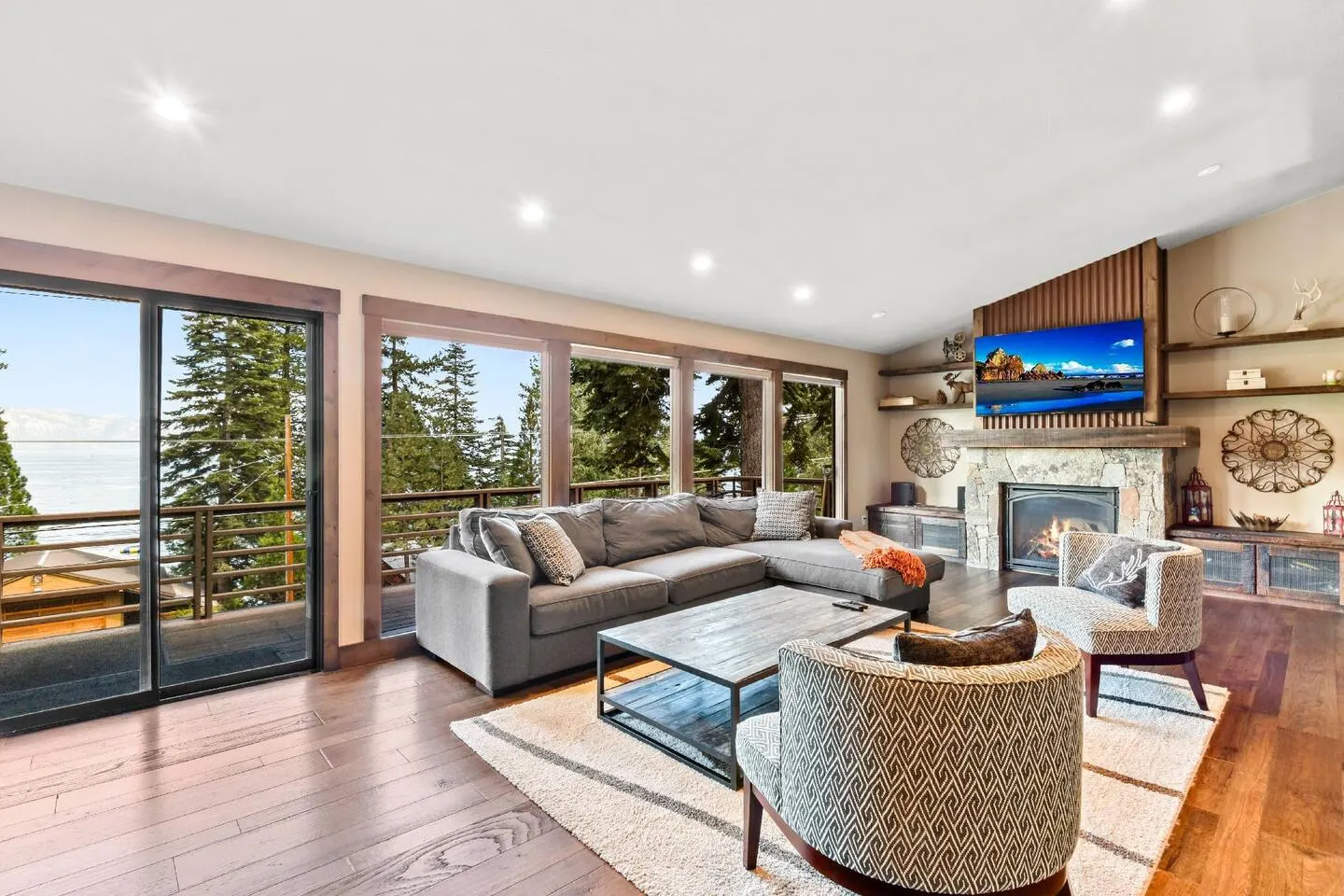 Lake-view living room at Tranquil Tahoe Haven, an MG-managed home