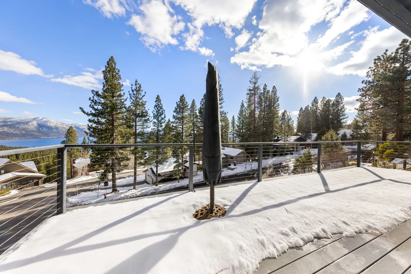The third-floor deck at Incline Lakehouse Lookout, an MG home in Incline Village, looking toward the lake in winter