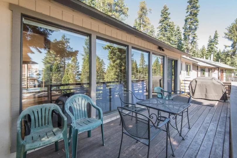 Outdoor seating and dining on the deck at Tranquil Tahoe Haven in Carnelian Bay