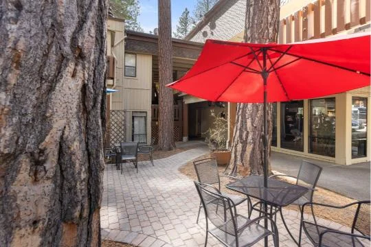 Outdoor seating and dining on the deck at Treetop on Country Club in Incline Village